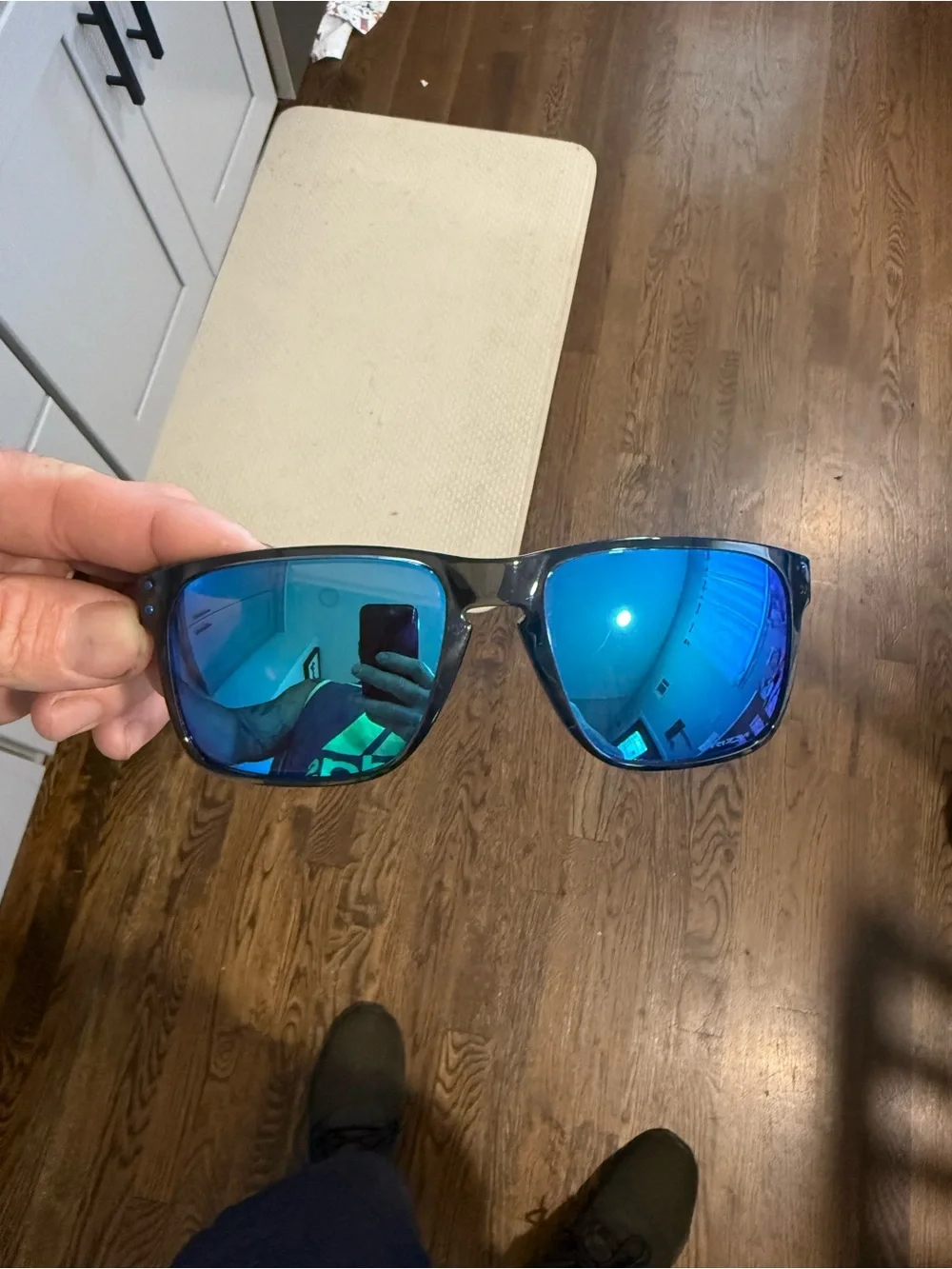 Oakley Black Frame Sunglasses with Blue Mirrored Lenses